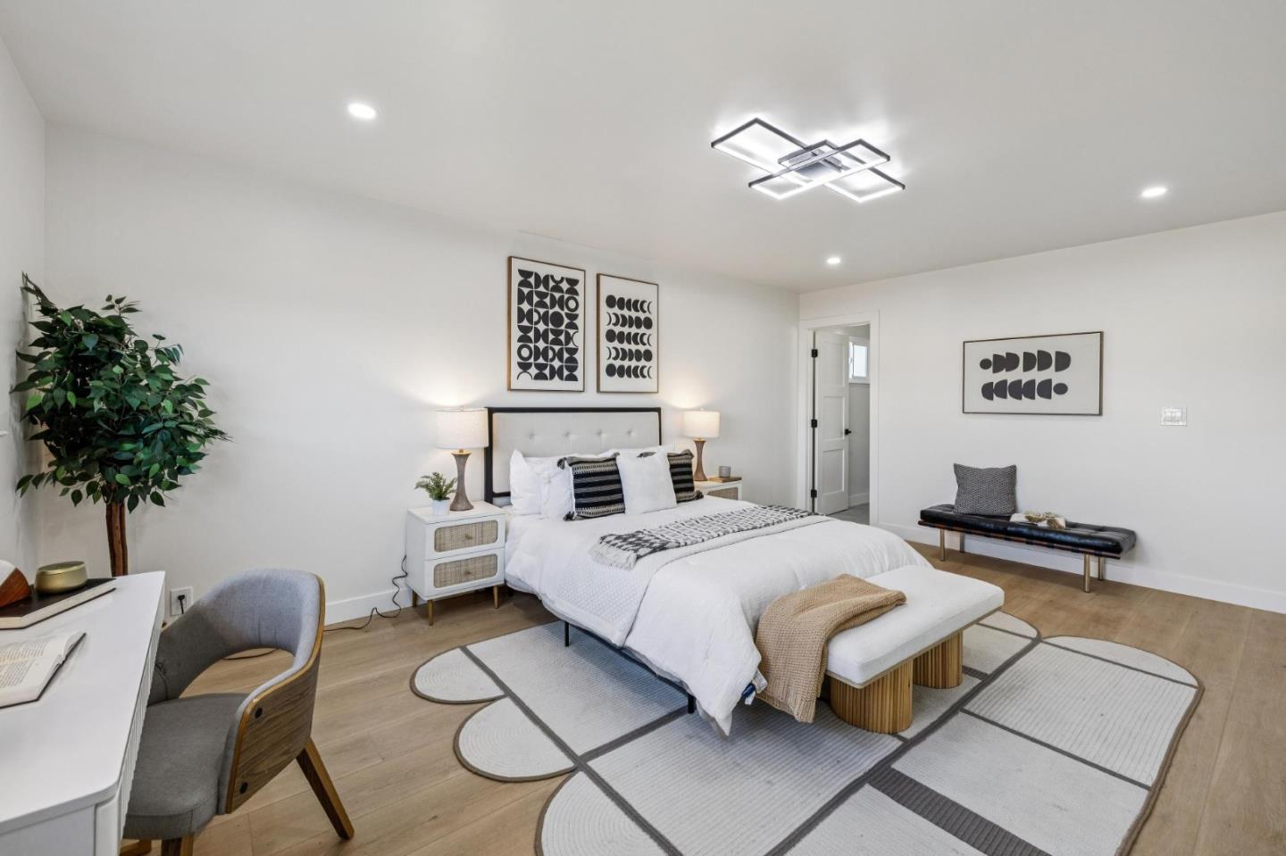 2043 Shellback Place San Jose, CA 95133 - Photo 25 of 52 a bedroom with a bed and a chandelier