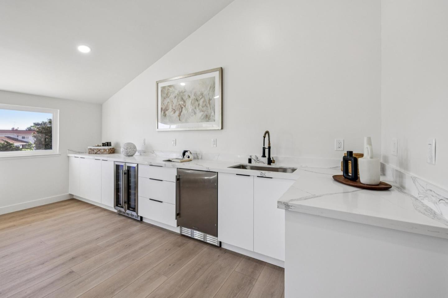2043 Shellback Place San Jose, CA 95133 - Photo 35 of 52 a kitchen with a sink and a stove top oven