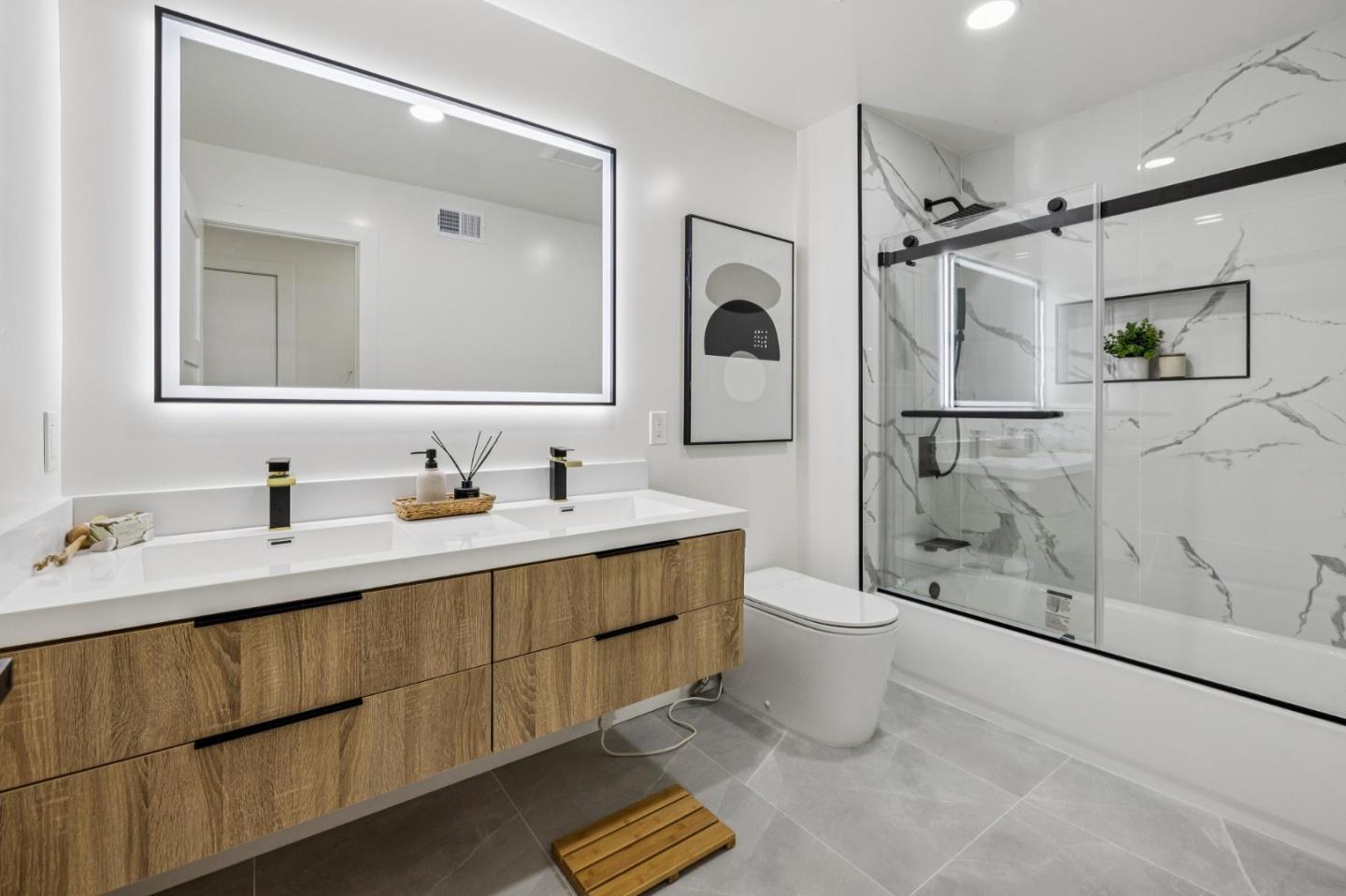 2043 Shellback Place San Jose, CA 95133 - Photo 36 of 52 a bathroom with a double vanity sink toilet and shower