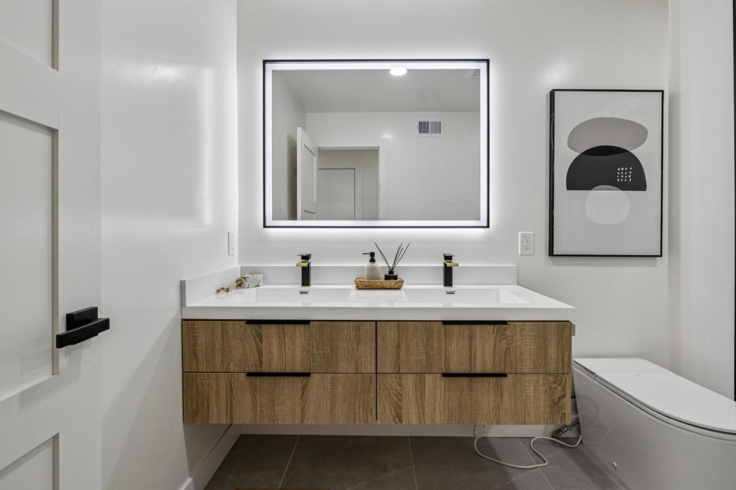 2043 Shellback Place San Jose, CA 95133 - Photo 37 of 52 a bathroom with a toilet sink and mirror