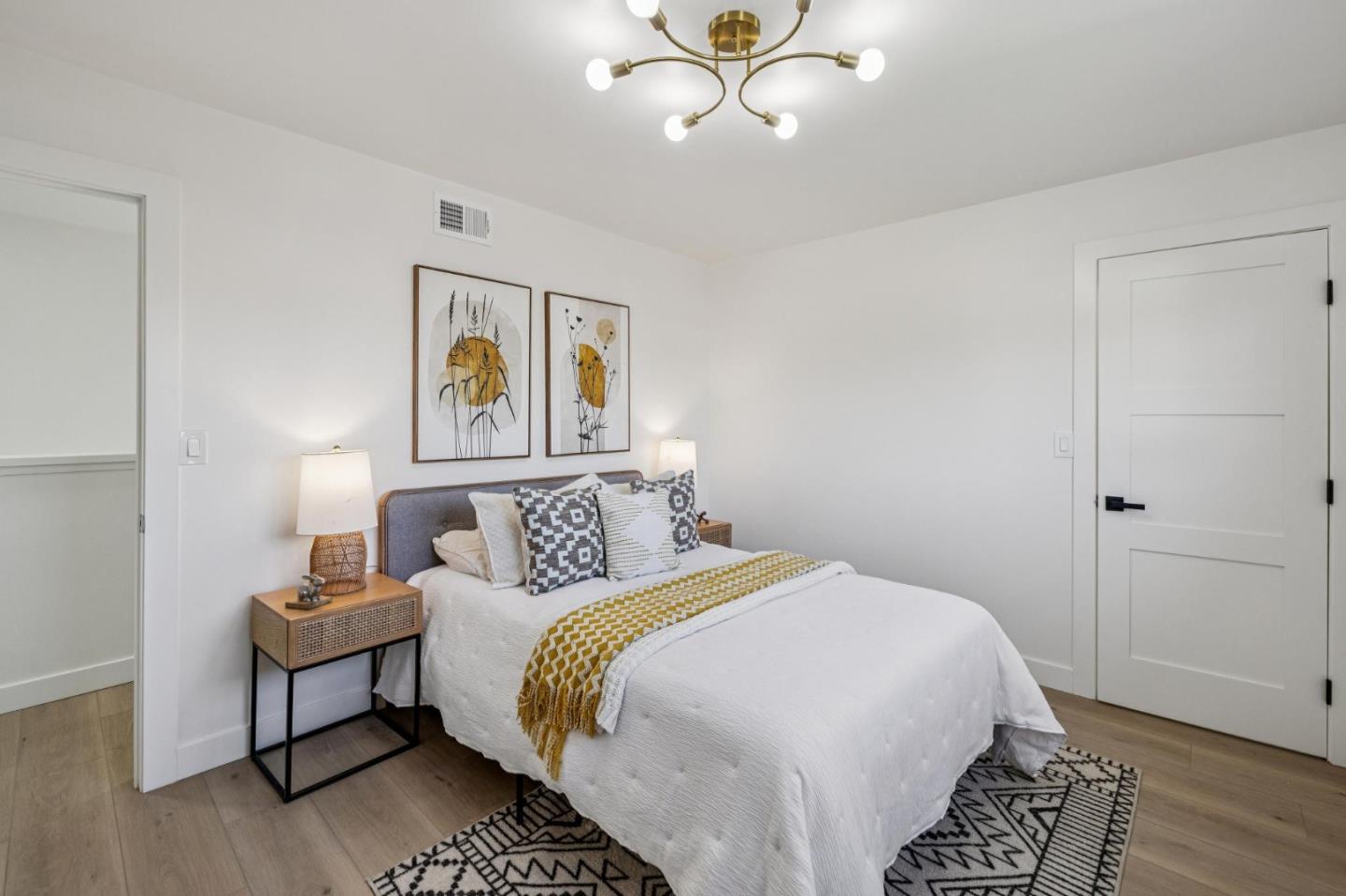 2043 Shellback Place San Jose, CA 95133 - Photo 38 of 52 a bedroom with a bed and painting on the wall