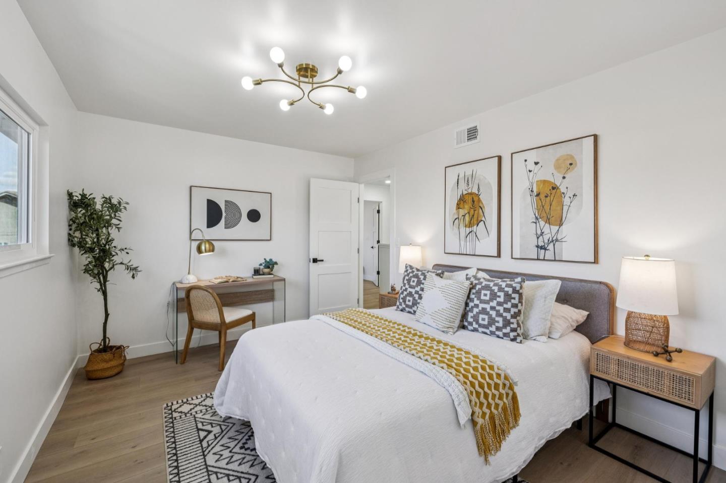 2043 Shellback Place San Jose, CA 95133 - Photo 39 of 52 a bedroom with bed and a chandelier