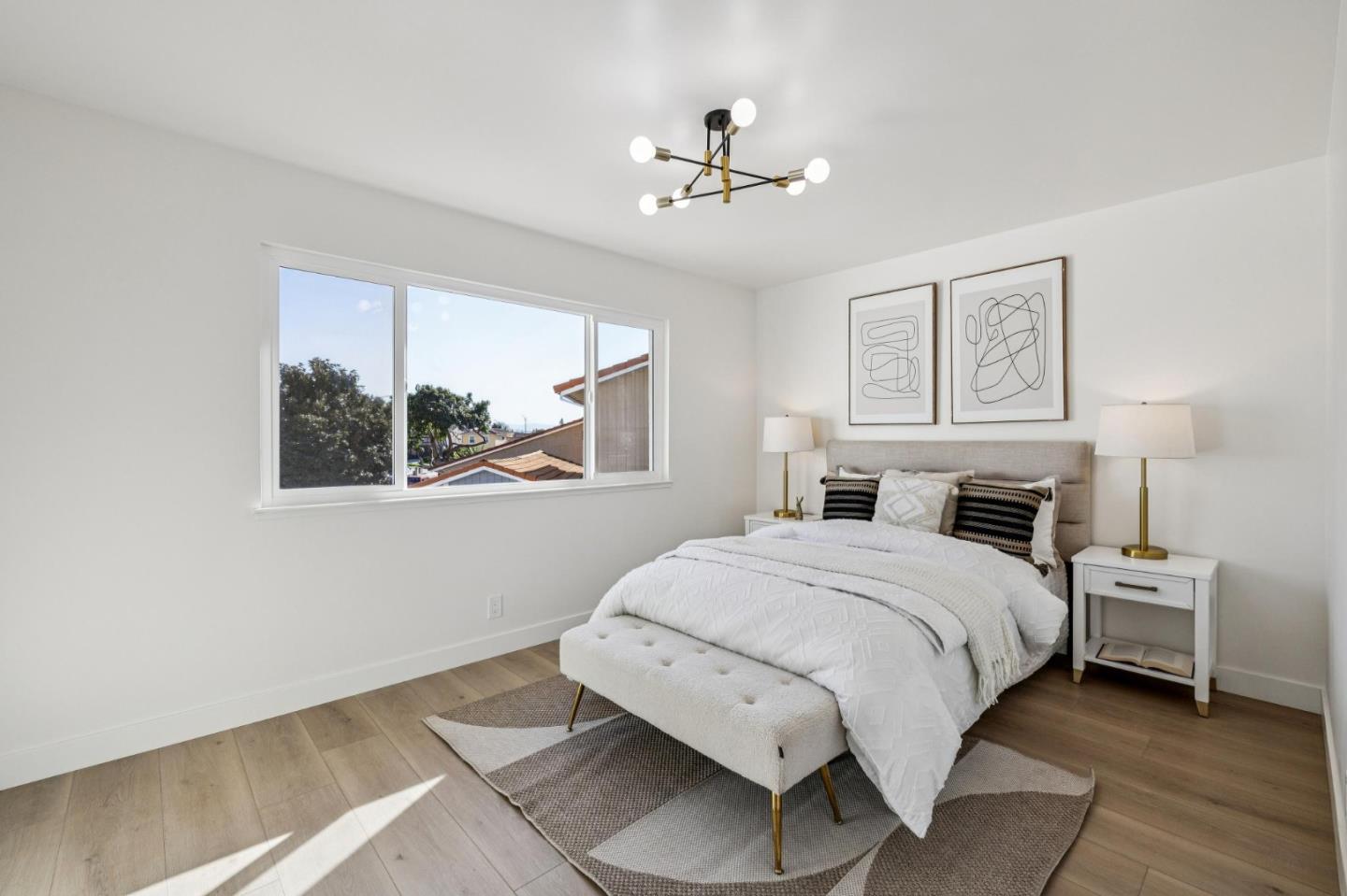 2043 Shellback Place San Jose, CA 95133 - Photo 40 of 52 a spacious bedroom with a bed and a window