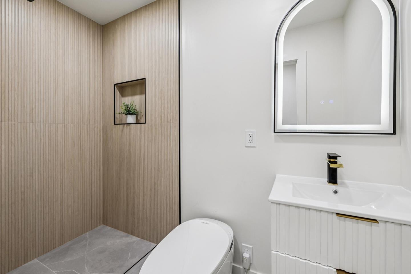 2043 Shellback Place San Jose, CA 95133 - Photo 43 of 52 a bathroom with a toilet a sink and mirror