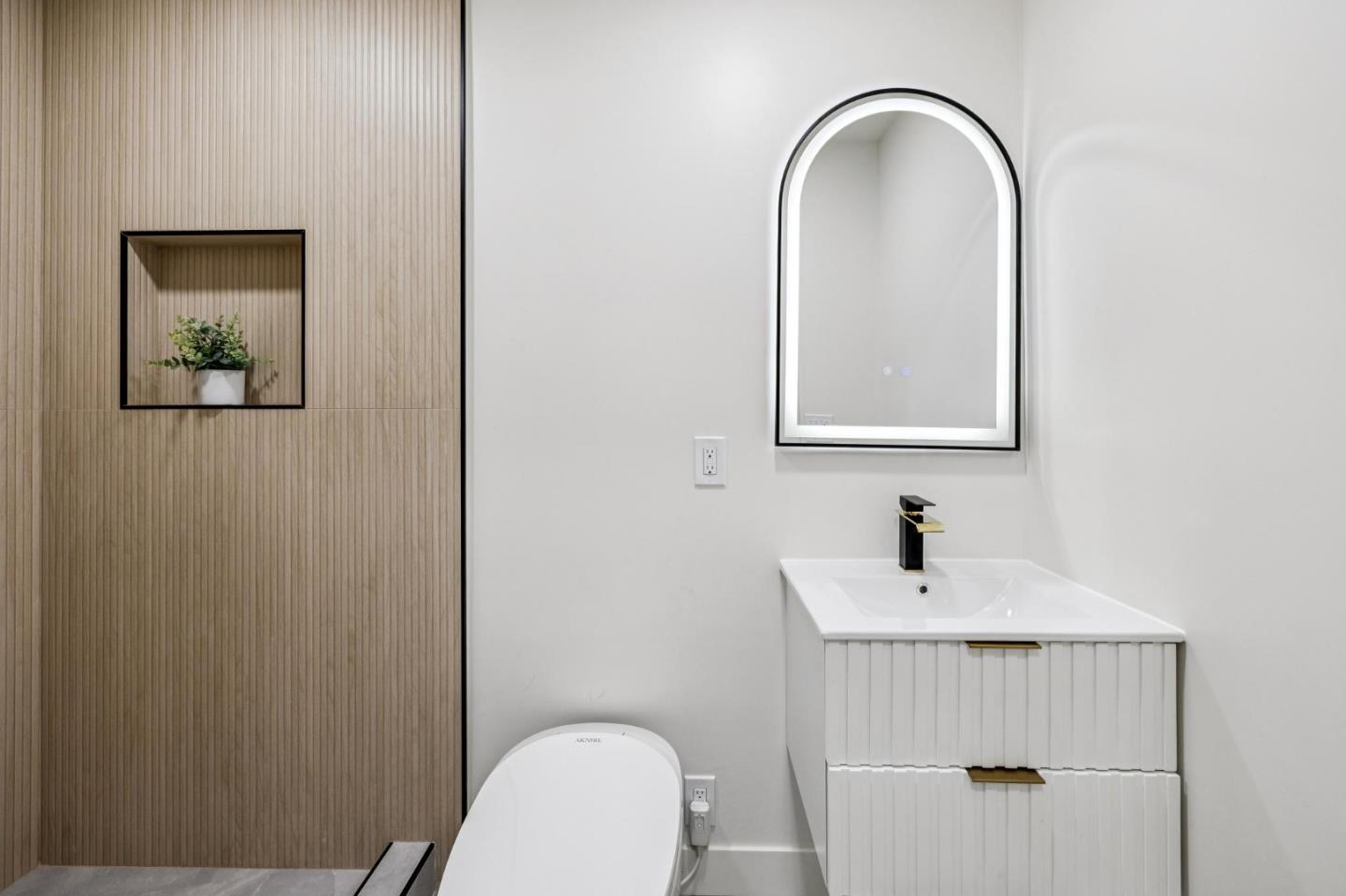 2043 Shellback Place San Jose, CA 95133 - Photo 44 of 52 a bathroom with a toilet a sink and mirror