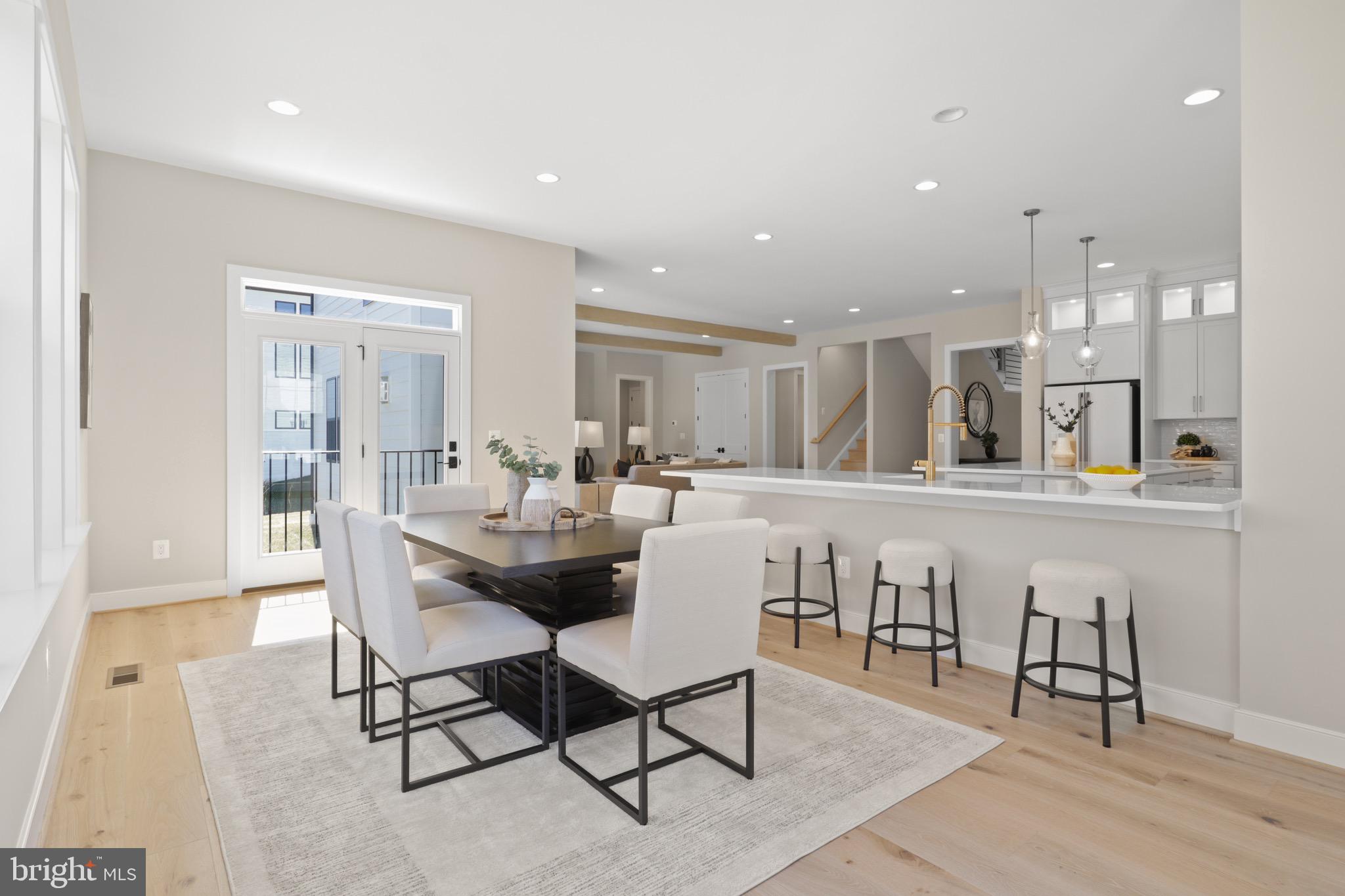 1749 Beulah Road Vienna, VA 22182 - Photo 27 of 88 a dining hall with stainless steel appliances kitchen island a table and chairs