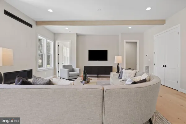 a living room with furniture and a window with outer view