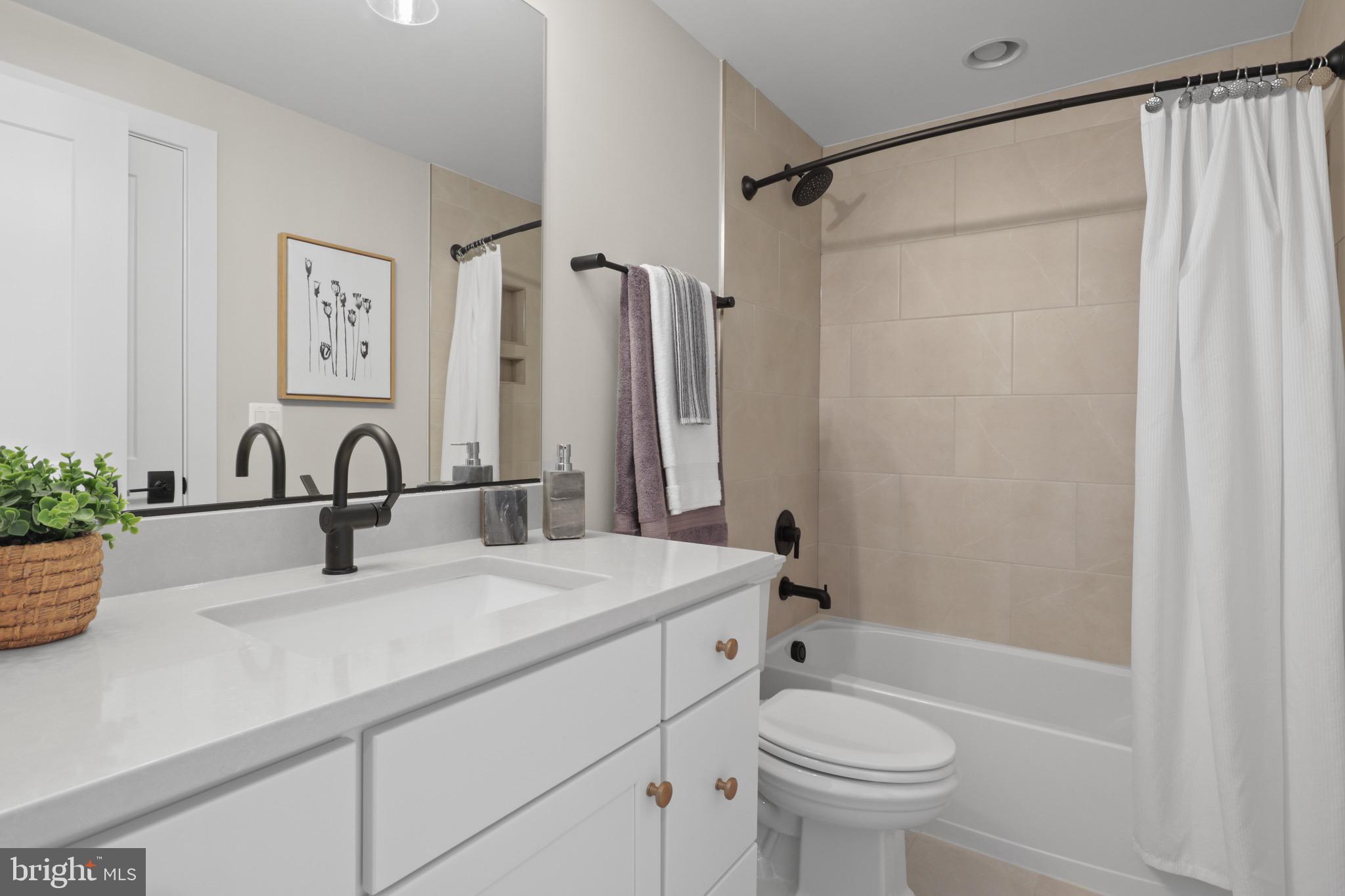 1749 Beulah Road Vienna, VA 22182 - Photo 87 of 88 a bathroom with a sink a toilet and a bathtub