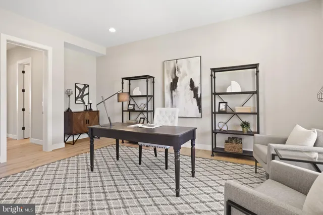 a kitchen with stainless steel appliances granite countertop a sink a stove a refrigerator and chairs