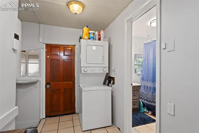 a utility room with closet dryer and washer