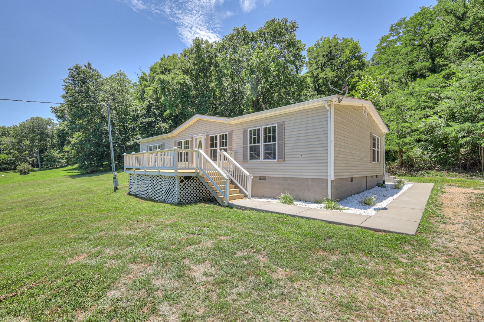 4002 Rippey Lake Road Mount Pleasant, TN 38474 - Photo 5 of 43 a house view with a sitting space and garden