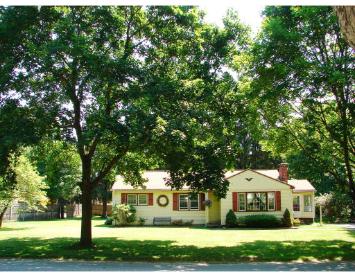 80 South Meadow Road Lancaster, MA 01523 - Photo 1 of 17 a front view of a house with a garden