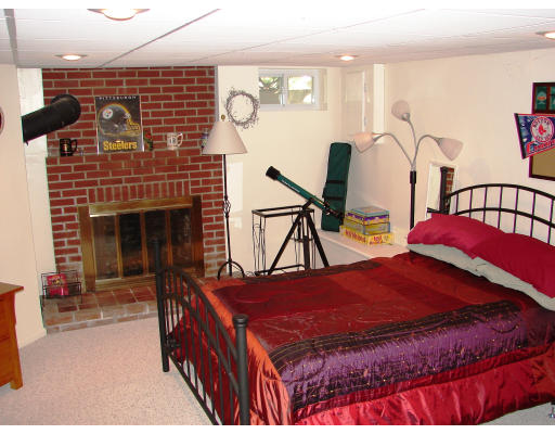 80 South Meadow Road Lancaster, MA 01523 - Photo 15 of 17 a bedroom with a bed a table and chair