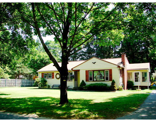 80 South Meadow Road Lancaster, MA 01523 - Photo 2 of 17 a front view of a house with a yard and garage