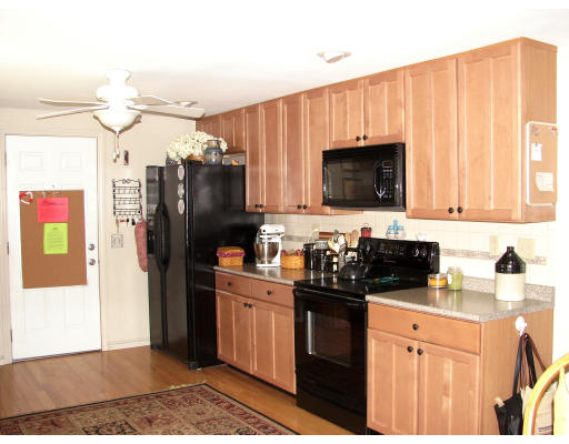 80 South Meadow Road Lancaster, MA 01523 - Photo 4 of 17 a kitchen with stainless steel appliances granite countertop a refrigerator stove and sink