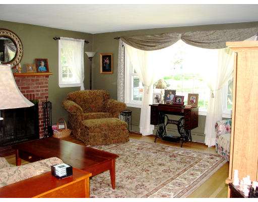 80 South Meadow Road Lancaster, MA 01523 - Photo 7 of 17 a living room with furniture and a fireplace