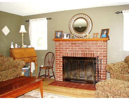 80 South Meadow Road Lancaster, MA 01523 - Photo 8 of 17 a living room with furniture and a fireplace