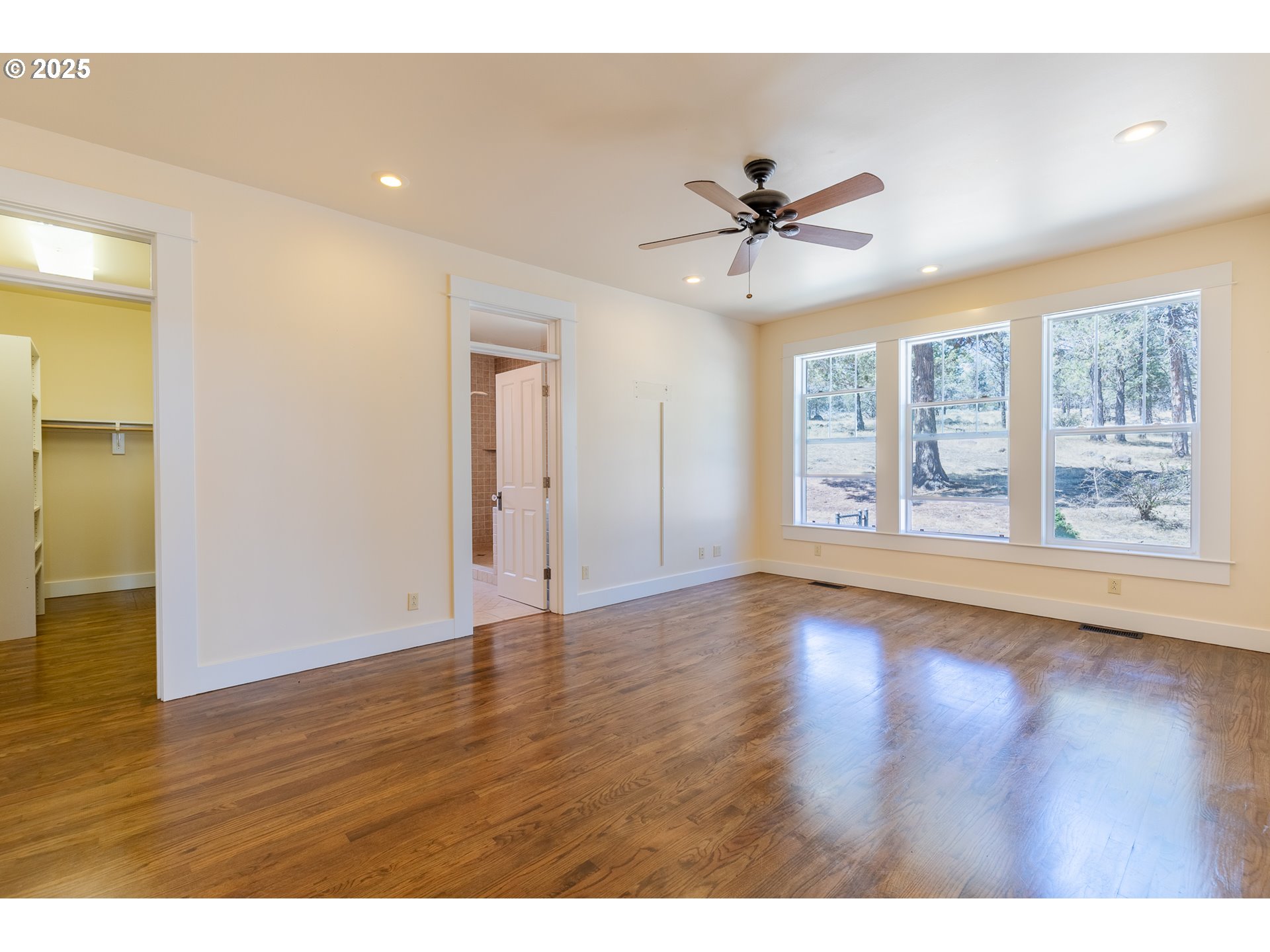 7140 Jake Road Klamath Falls, OR 97601 - Photo 13 of 47 a view of an empty room with wooden floor and a window