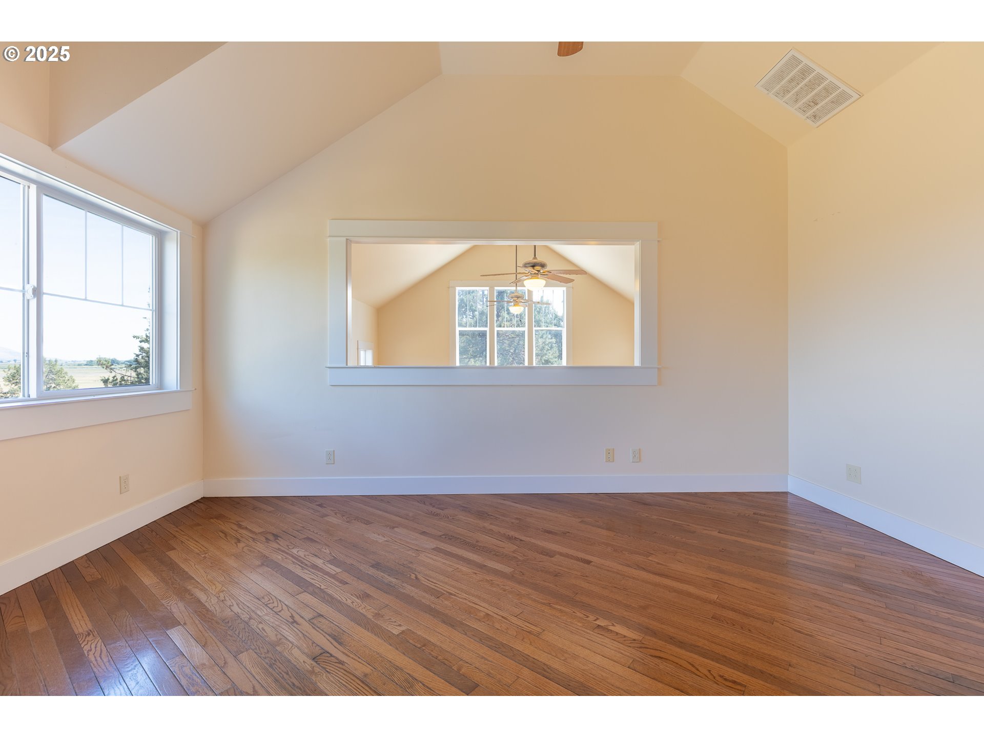 7140 Jake Road Klamath Falls, OR 97601 - Photo 22 of 47 an empty room with wooden floor and windows