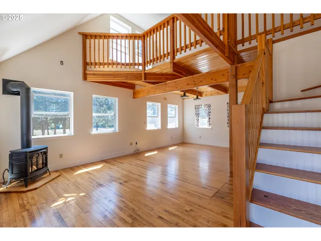 a view of an entryway with wooden floor