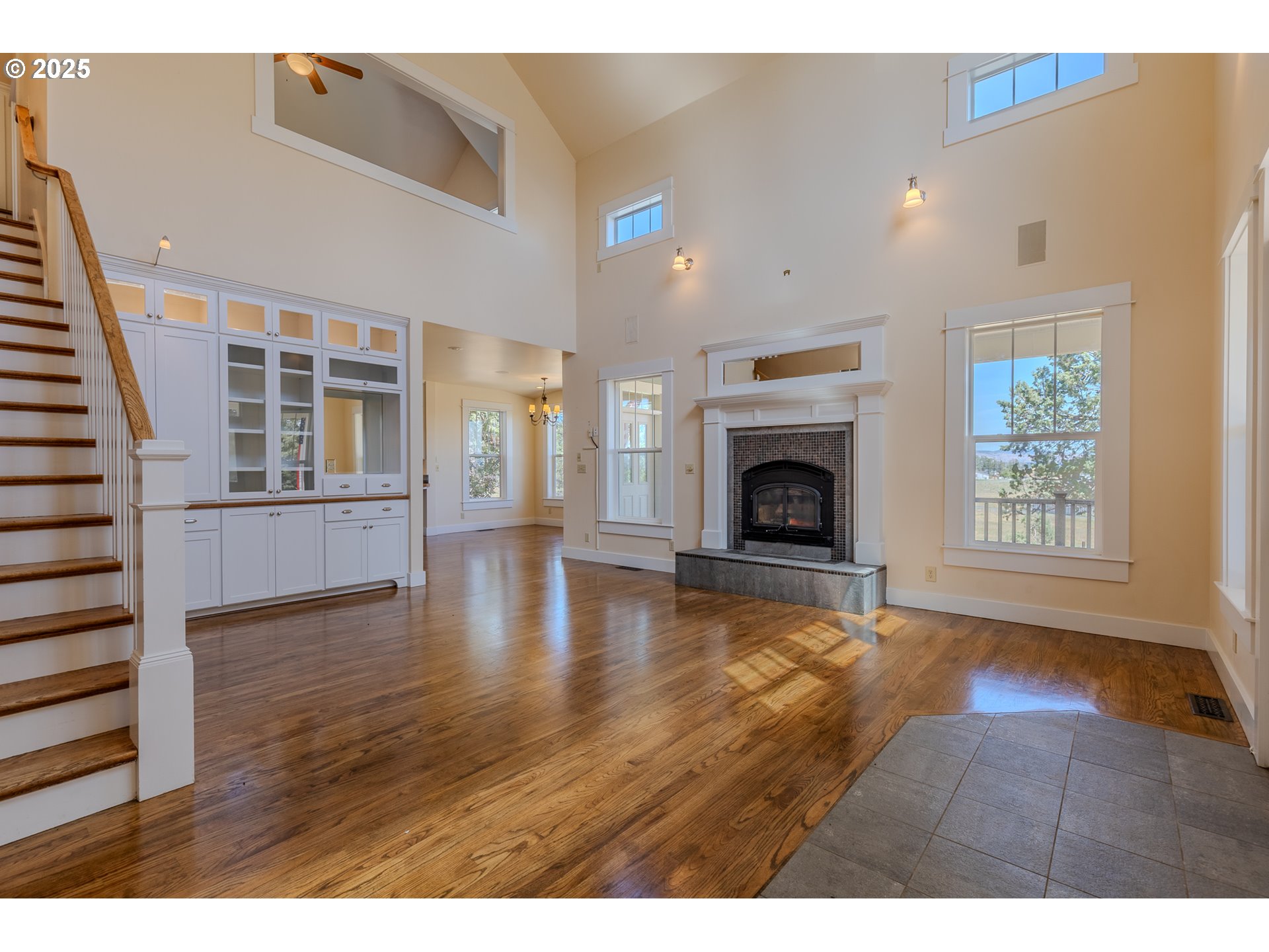 7140 Jake Road Klamath Falls, OR 97601 - Photo 4 of 47 a view of an empty room with wooden floor fireplace and a window
