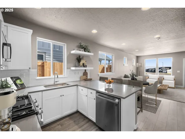 a kitchen with a sink stove and cabinets