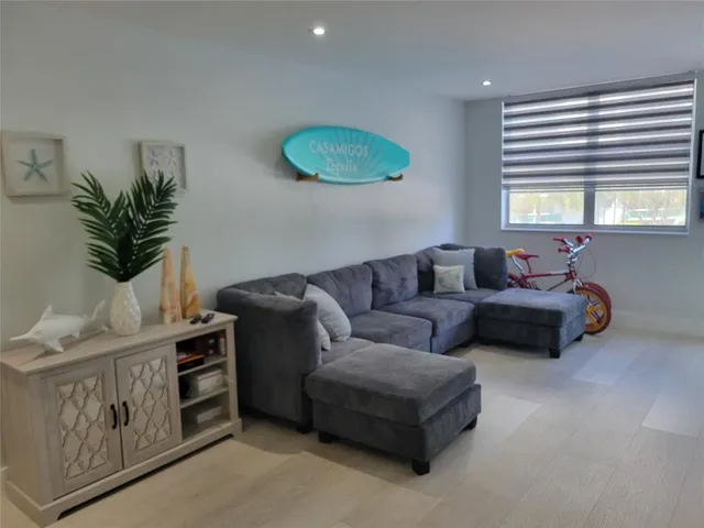 a living room with furniture and window