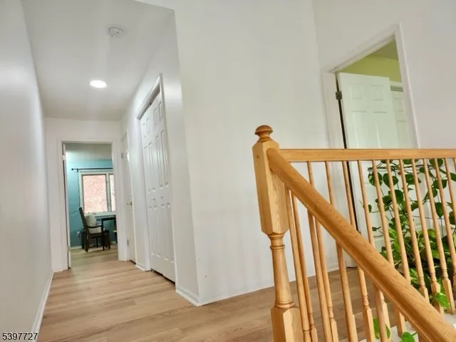 a view of an entryway with wooden floor