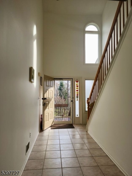 48 Edgefield Drive Morris Plains, NJ 07950 - Photo 17 of 21 a view of an entryway with a floor to ceiling window and fire place