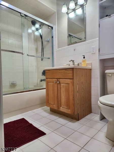 48 Edgefield Drive Morris Plains, NJ 07950 - Photo 19 of 21 a bathroom with a sink a toilet and shower