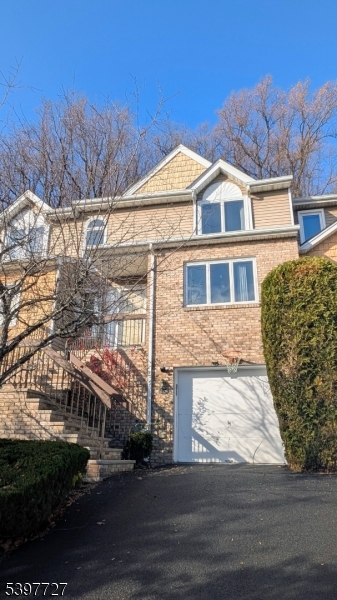 48 Edgefield Drive Morris Plains, NJ 07950 - Photo 2 of 21 a front view of a house with a yard