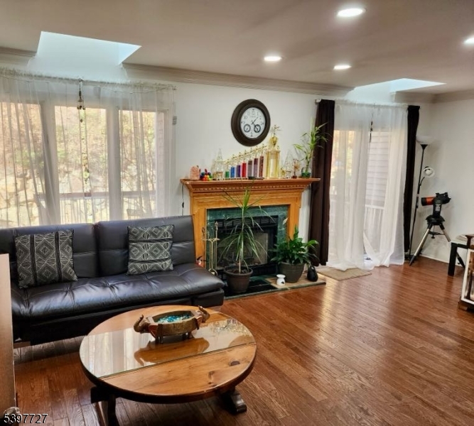 48 Edgefield Drive Morris Plains, NJ 07950 - Photo 5 of 21 a living room with furniture and a fireplace