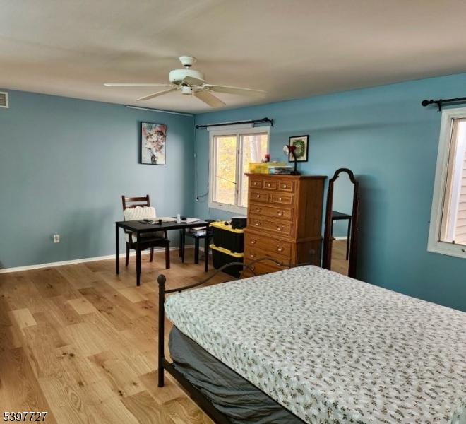 48 Edgefield Drive Morris Plains, NJ 07950 - Photo 10 of 21 a bedroom with a bed dresser and a dining table