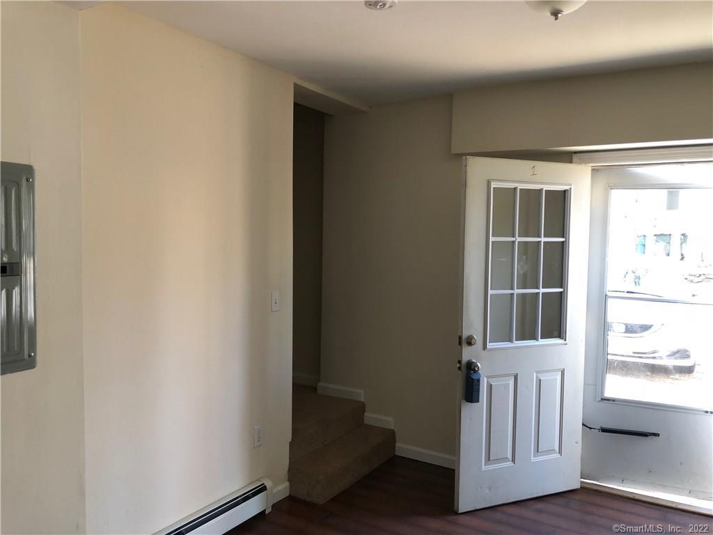 155 Dividend Road, Unit 1 Rocky Hill, CT 06067 - Photo 11 of 13 VIEW FROM KITCHEN TO FRONT DOOR AND STAIRWAY