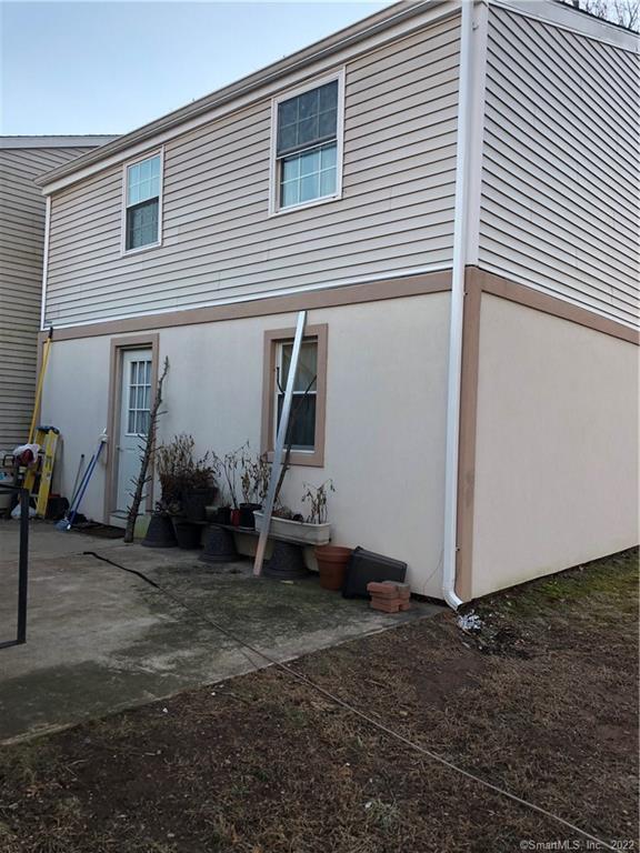 155 Dividend Road, Unit 1 Rocky Hill, CT 06067 - Photo 13 of 13 BACK SIDE WITH PRIVATE PATIO