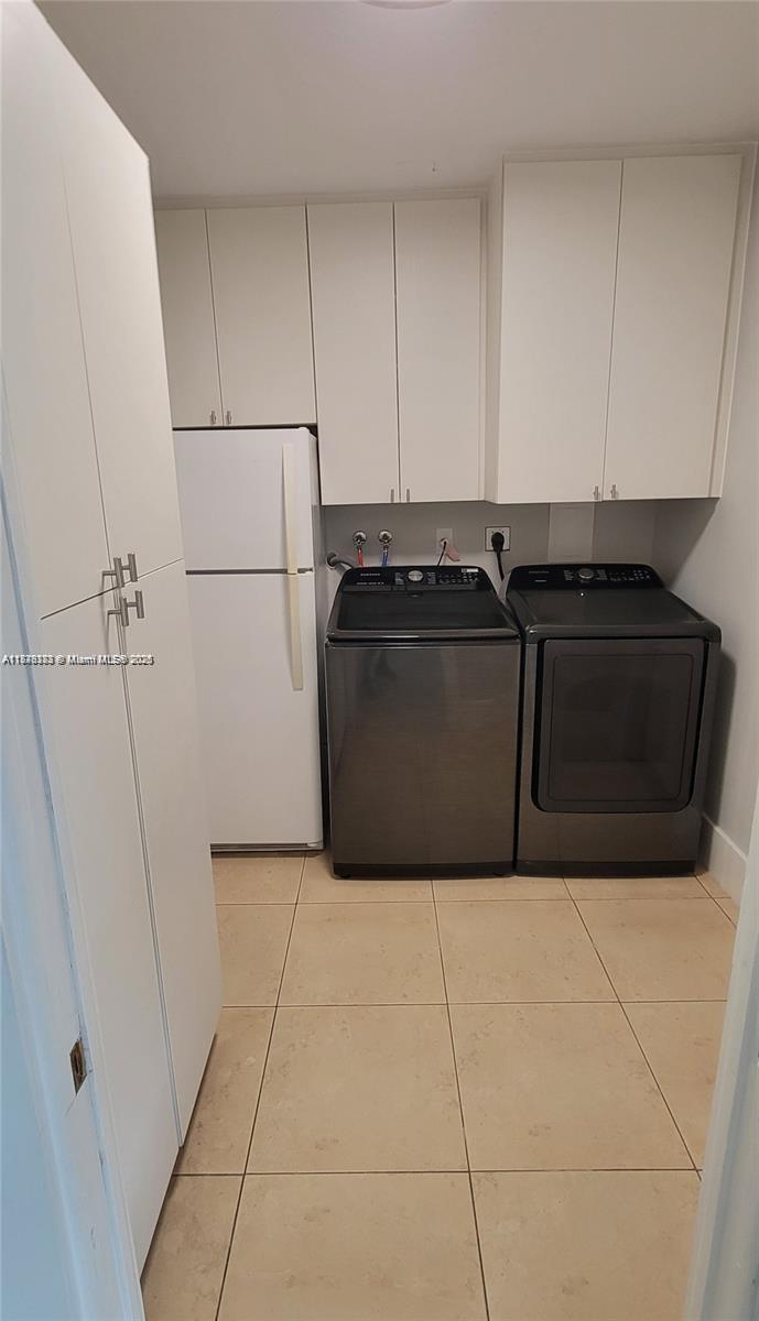 2710 Southwest 31st Avenue Miami, FL 33133 - Photo 13 of 29 a kitchen with cabinets and a stove