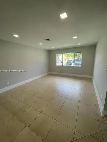 a view of an empty room and window