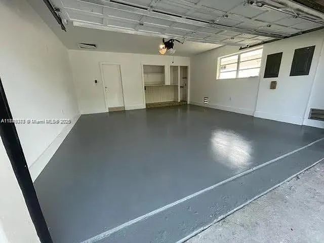 a view of a house with palm trees