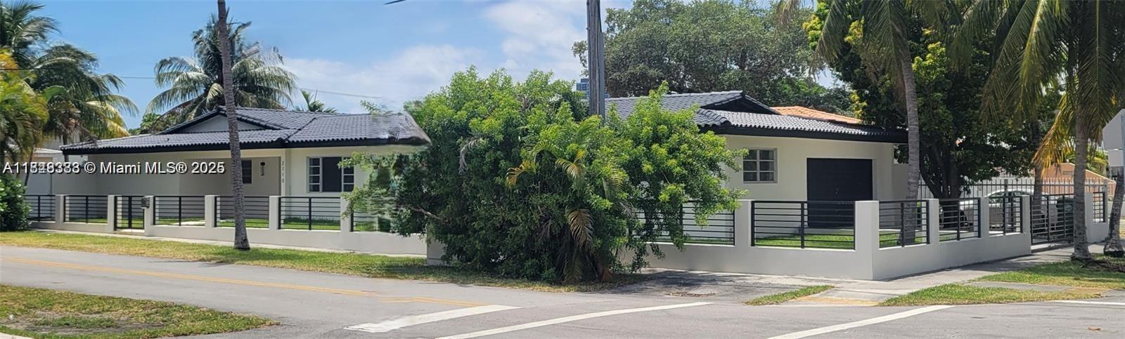 2710 Southwest 31st Avenue Miami, FL 33133 - Photo 29 of 29 a view of a house with palm trees