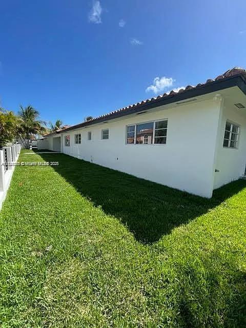 2710 Southwest 31st Avenue Miami, FL 33133 - Photo 5 of 29 a view of a backyard with plants and a garden