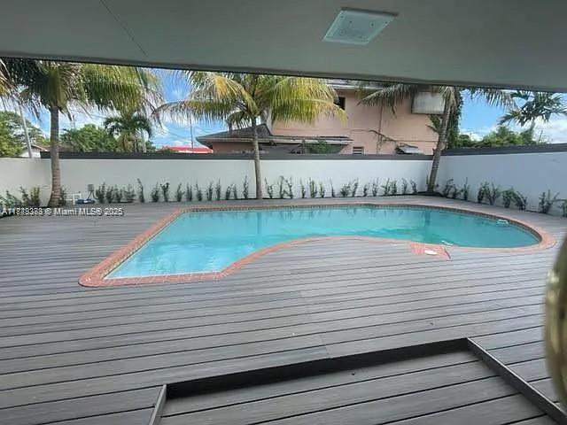 2710 Southwest 31st Avenue Miami, FL 33133 - Photo 8 of 29 a view of a pool with outdoor seating