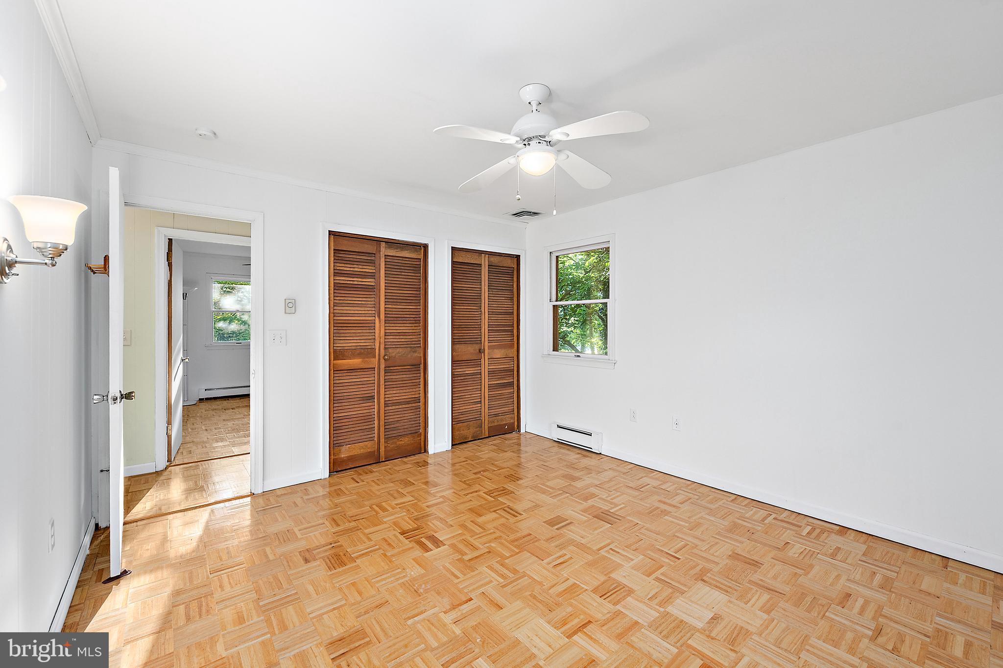 6181 Rockawalkin Road Salisbury, MD 21801 - Photo 47 of 65 an empty room with closet and windows