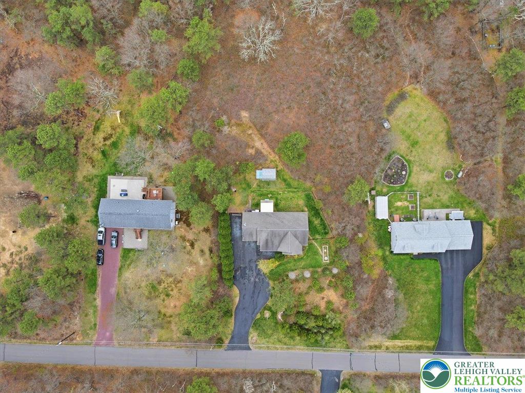 64 Robertson Road Jim Thorpe, PA 18229 - Photo 50 of 54 front view of a house with a yard and fountain