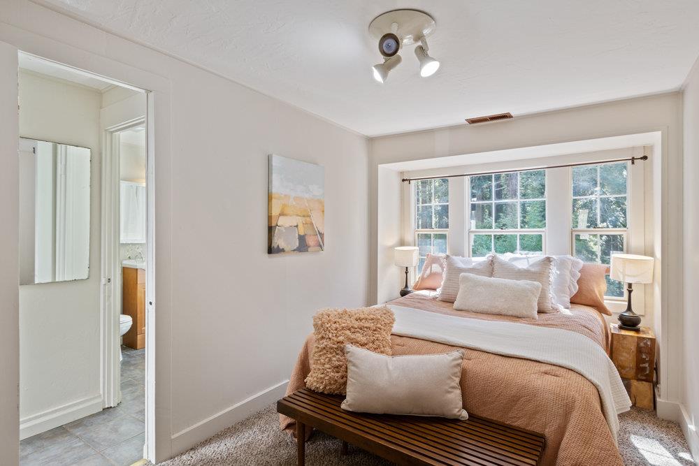 1003 Laurel Glen Road Soquel, CA 95073 - Photo 12 of 115 a bedroom with a bed and wooden floor