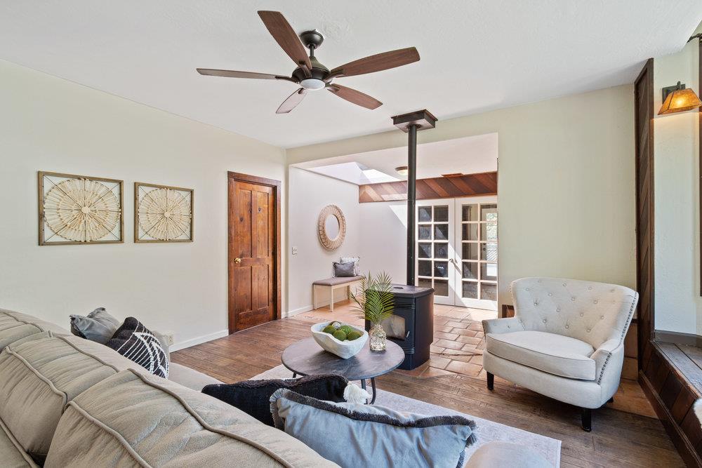 1003 Laurel Glen Road Soquel, CA 95073 - Photo 15 of 115 a living room with furniture a ceiling fan and a window