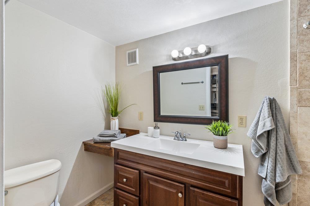 1003 Laurel Glen Road Soquel, CA 95073 - Photo 23 of 115 a bathroom with a granite countertop sink and a mirror