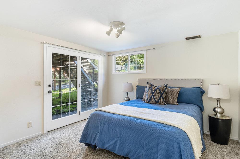 1003 Laurel Glen Road Soquel, CA 95073 - Photo 25 of 115 a bed sitting in a bedroom next to a window