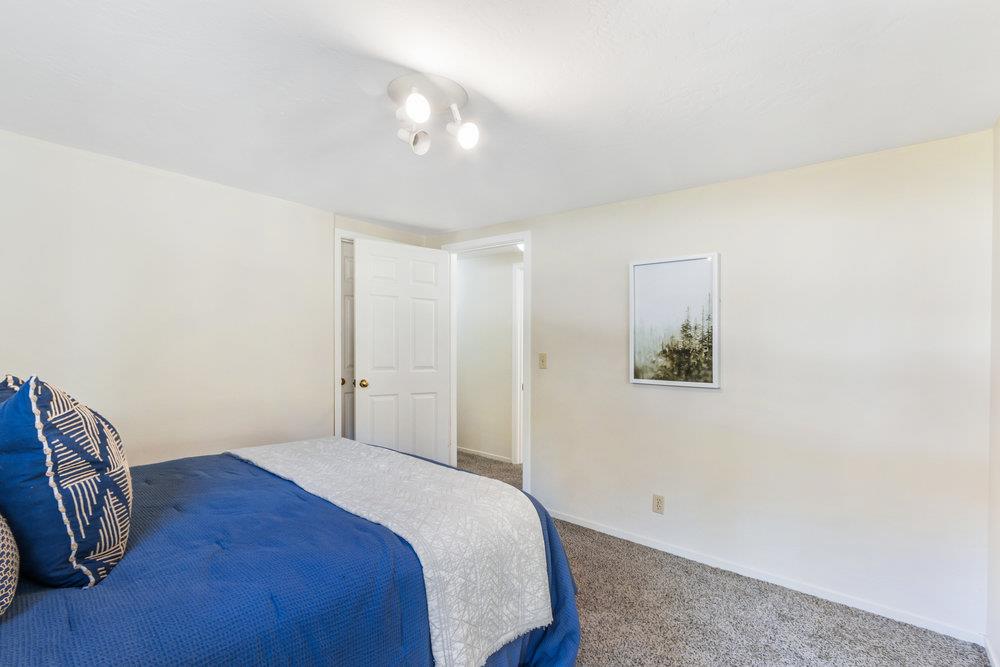 1003 Laurel Glen Road Soquel, CA 95073 - Photo 27 of 115 a bedroom with a bed and a painting on the wall