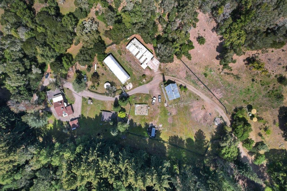 1003 Laurel Glen Road Soquel, CA 95073 - Photo 3 of 115 an aerial view of a house with a yard and trees