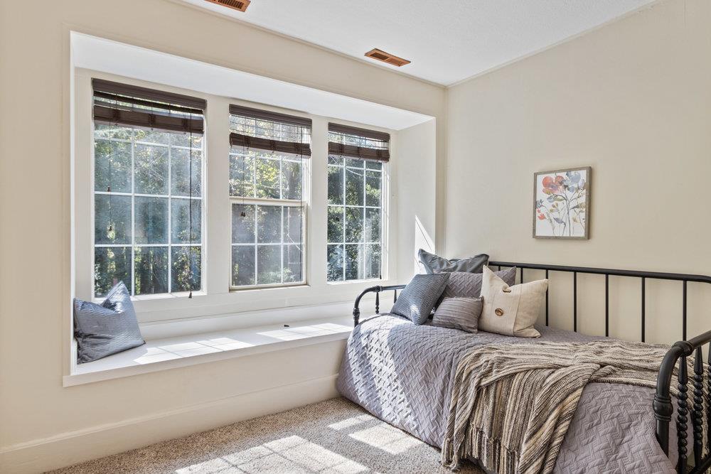 1003 Laurel Glen Road Soquel, CA 95073 - Photo 47 of 115 a spacious bedroom with a large bed and a large window